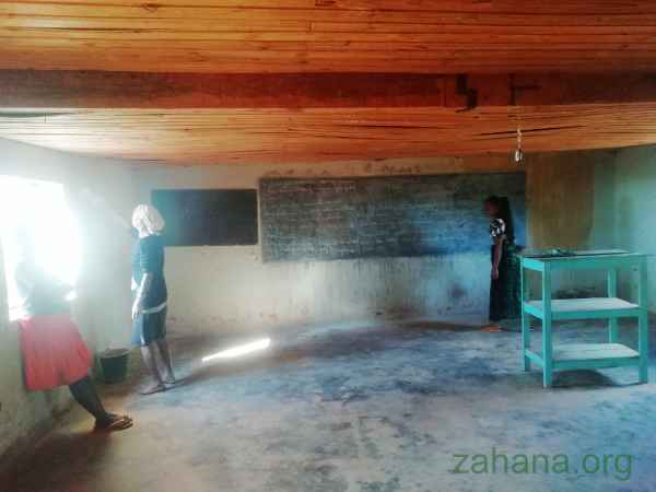 Painting the school inside with clay in Madagascar