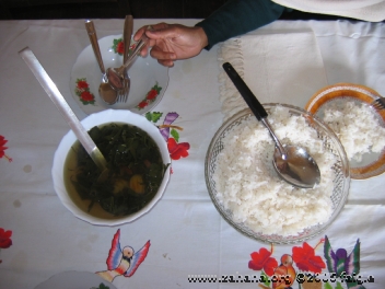 eating leave soup with rice in Madagascar