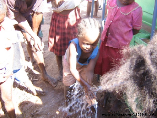 children touching the fresh water 2